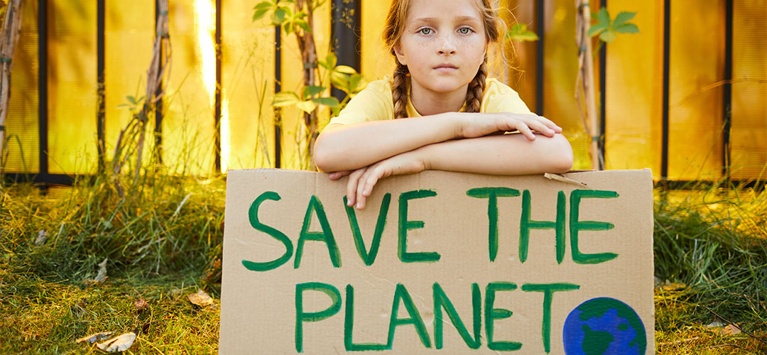 girl-holding-save-the-planet-sign